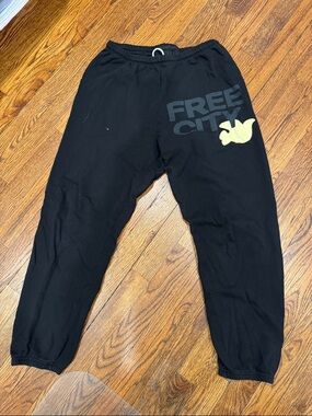 freecity Black Sweatpants with Pale Yellow Dove Graphic
